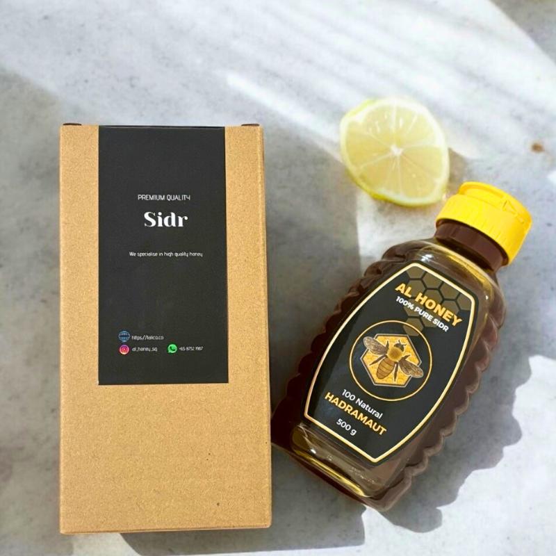 Top view of premium sidr honey squeeze bottles and packaging