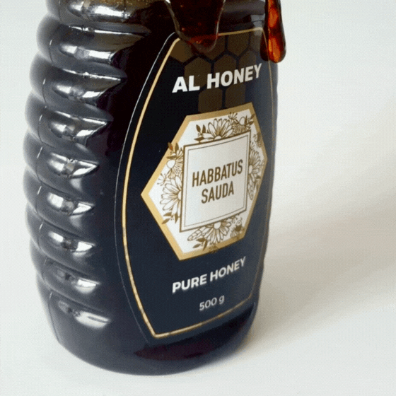 Front view al honey blackseed squeeze bottle with honey dripping