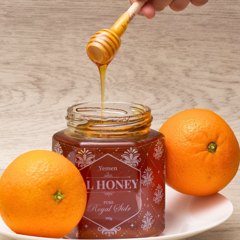 Al Honey's delicious Royal Sidr Honey. Showing the Purity and deliciousness of Honey with oranges to show freshness.