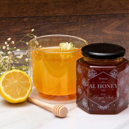 Front photo of Al Honey Royal sidr with Honey juice in a glass and lemon