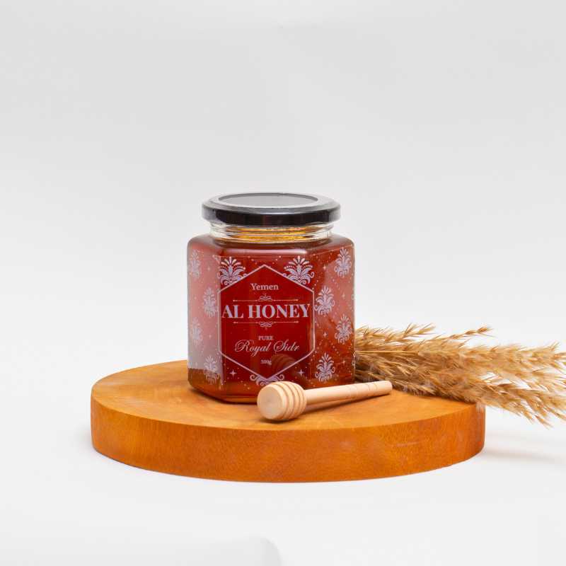Front photo of Al Honey Royal Sidr on a wooden platform  with wooden dipper 