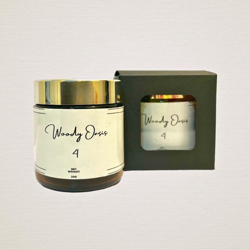 Showing a front view of woody oasis bukhoor no.4 from the front and showing the packaging.