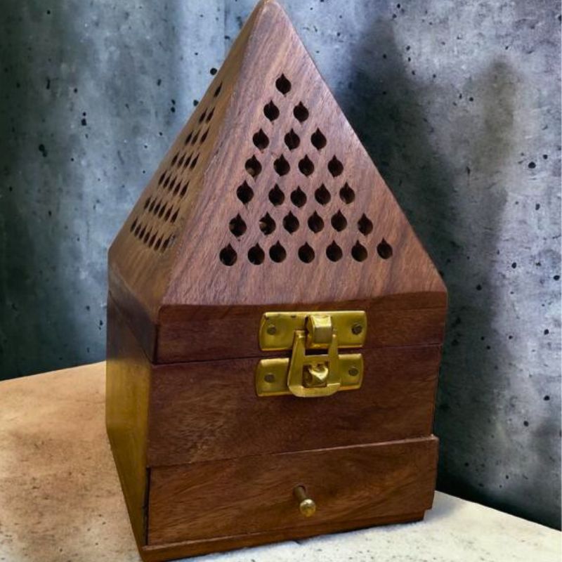 Showing a from view of woody Oasis wooden burner with a small drawer for bukhoor, oud and agarwood. Lifestyle photo.